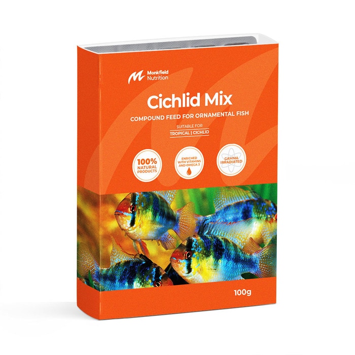 Packaging of Monkfield Nutrition Cichlid Mix compound feed for ornamental fish, featuring an orange box with vibrant, colorful cichlid fish on the front, suitable for tropical cichlid fish, enriched with vitamins and omega-3, and gamma irradiated for safety.